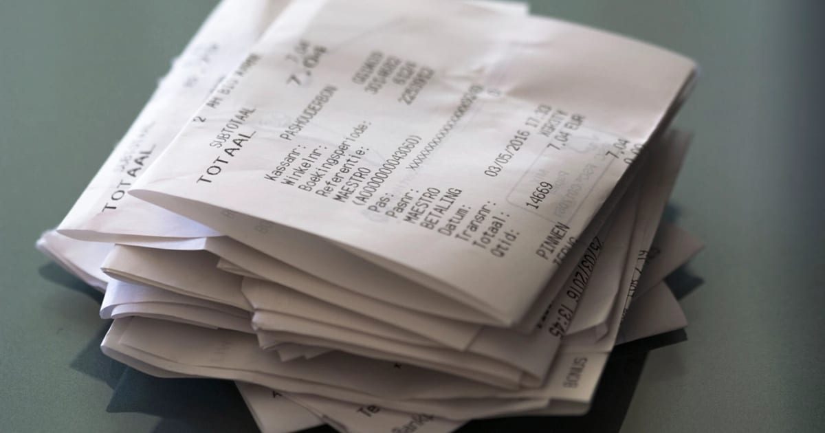 A loose stack of printed payment receipts